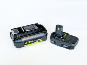 Two battery packs are shown on a white background. The left one is labeled "40V Lithium 4Ah," and the right one is a smaller black battery labeled with "Lithium." Both have connectors for charging or powering devices.