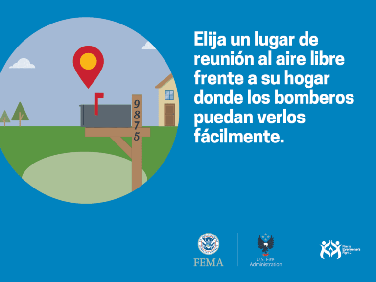 Illustration of a house and mailbox with the number 9875, set against a blue background. Text in Spanish advises to choose an outdoor meeting spot where firefighters can easily see you. Logos of FEMA, U.S. Fire Administration, and "Fire is Everyone's Fight" are shown.